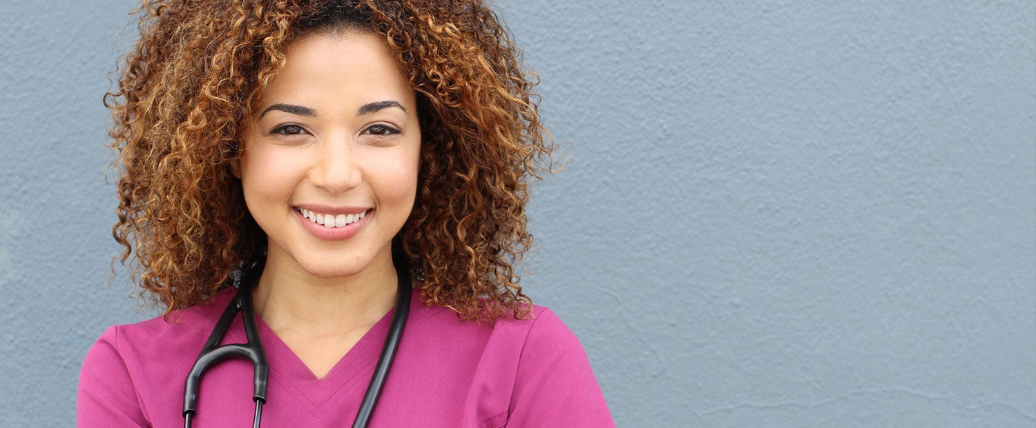 A nurse in pink uniform