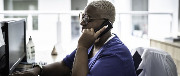Clinical person using telephone
