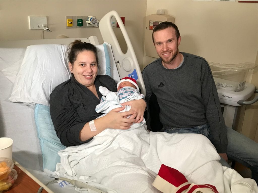 Carmelita Cruz and Aaron Carman hold their newborn son, Declan Charles, the 3,000th baby born at St. Peter’s Hospital in 2019